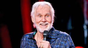 Amerikaanse Grootste Akteur Kenny Rogers — Donkerrooi Muurpapier
