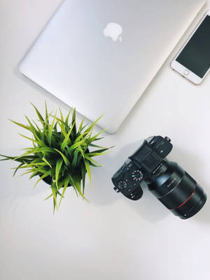 iPhone-lessenaar met Kamera — MacBook Muurpapier