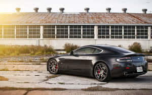 Aston Martin Vanquish in aksie op 'n skilderagtige pad — Steam Deck OLED Muurpapier