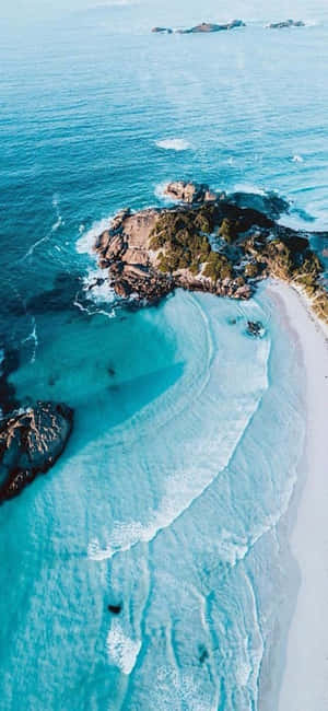 Betowerende Sonsondergang oor die Strand op iPhone X-agtergrond — Nothing Phone (3) Muurpapier