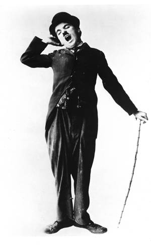 Charlie Chaplin showing a very sleepy expression while holding his cane wallpaper — Galaxy Tab S9 Ultra Muurpapier