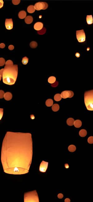 Gloeilamp op 'n Swart Agtergrond — Nokia C210 Muurpapier