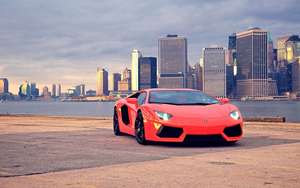 Motormuurpapier van 'n rooi Lamborghini Aventador in Brooklyn Bridge Park.