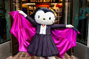 Lewensgrote Hello Kitty Halloween-vlermuis agtergrond — Hello Kitty Halloween Muurpapier