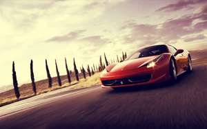 Motormuurpapier van 'n rooi Ferrari 458 Italia in beweging.