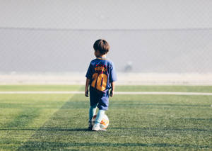 Kind sokker aanhanger Lionel Messi trui lessenaar agtergrond.