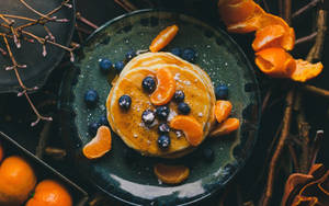 Pannekoek met Bessies en Lemoene agtergrond — 16:10 Muurpapier