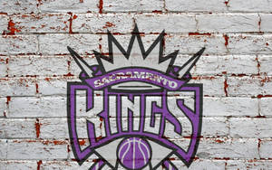 Sacramento Kings-logo in Baksteenmuur-agtergrond — Neutraal Muurpapier