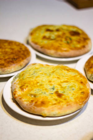 Verskillende gebakte Imeretiese Khachapuri-brood — Xiaomi Pad Muurpapier