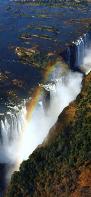 Victoria-waterval met 'n reënboog — Vivo V70 Lite Muurpapier